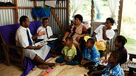 A family discussing the gospel together